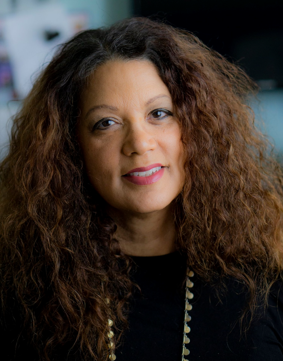 Author photo of Robin Lee Lovelace: smiling woman with full dark curly hair past her shoulders
