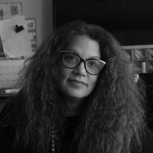 B&W Author photo of Robin Lee Lovelace: headshot of woman with thick, long, wavy dark hair, glasses.