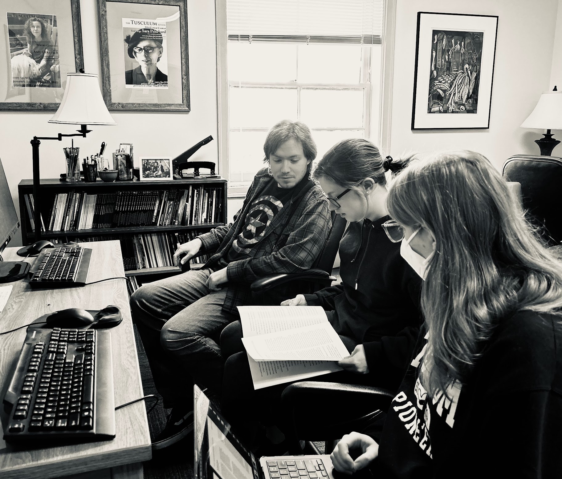 Z.T. Mitchell ('24), Kiersten Paxton ('25), and Lilliana Gall ('24) at work on Sit Lux side-by-side in the Publications Lab