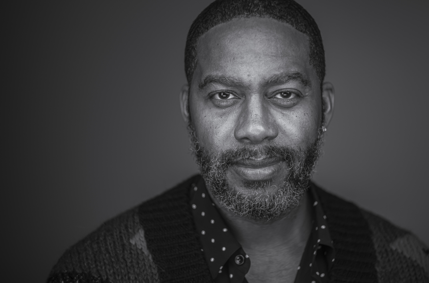 Black and white portrait of Mitchell S. Jackson with dark hair and beard. Photo by John Ricard.